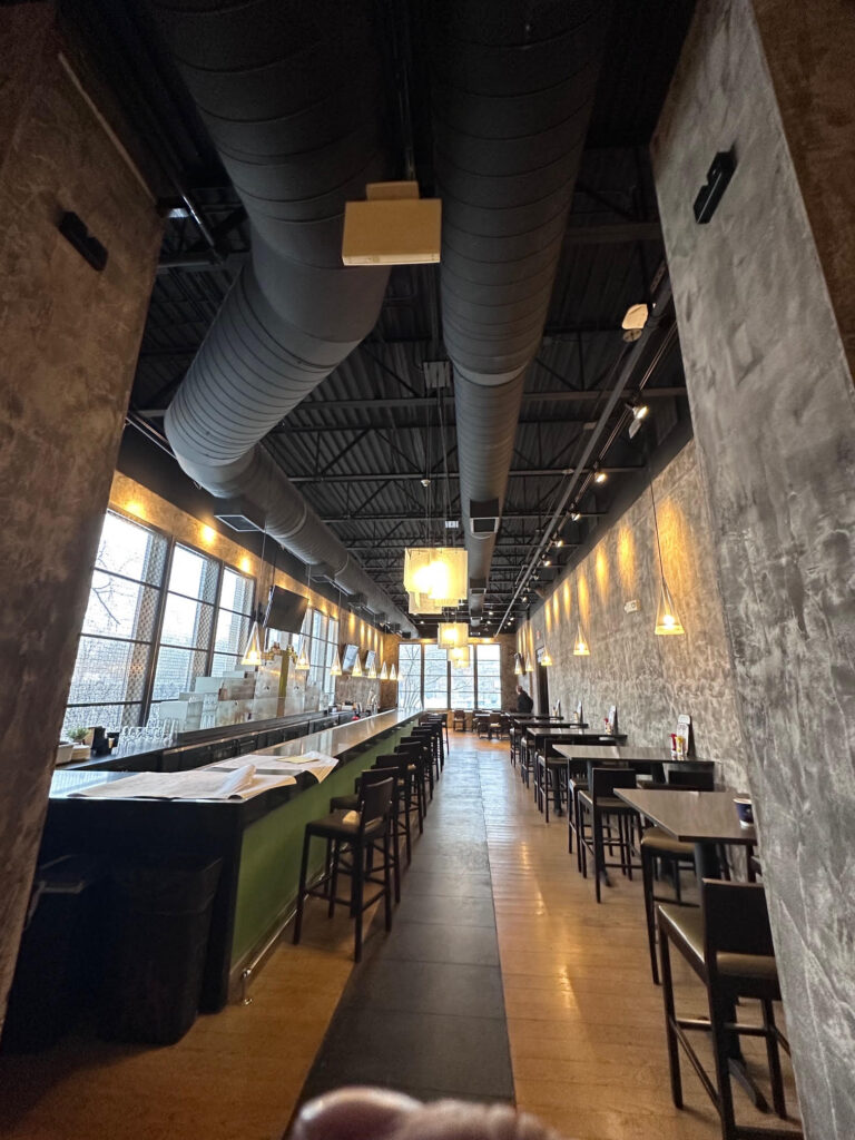 Exposed spiral ductwork over the bar in a hotel restaurant – Alltech HVAC commercial project