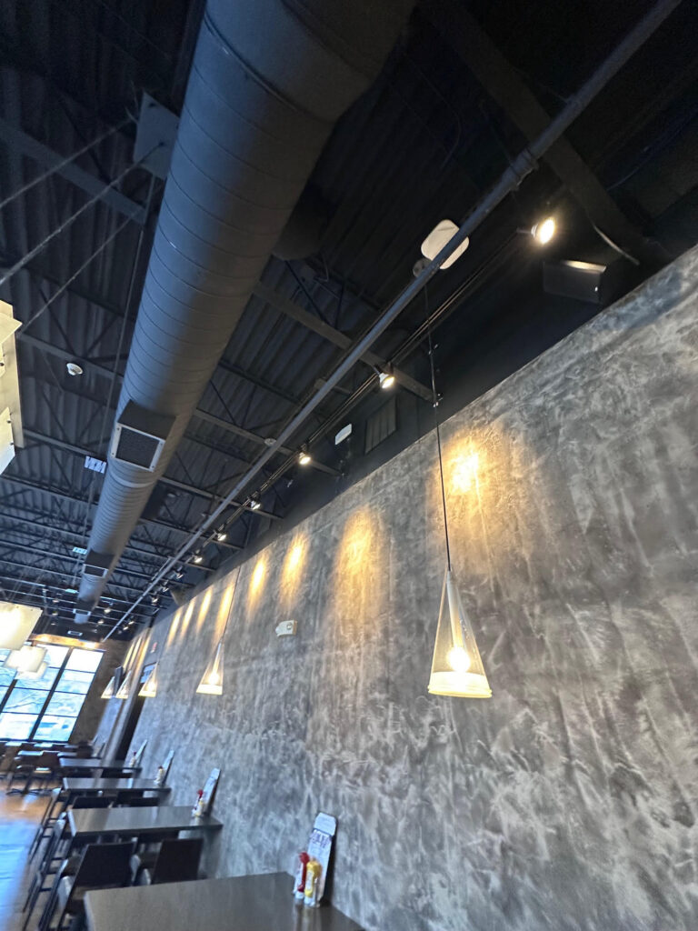 Long run of exposed spiral duct in a hotel restaurant – Alltech HVAC commercial HVAC